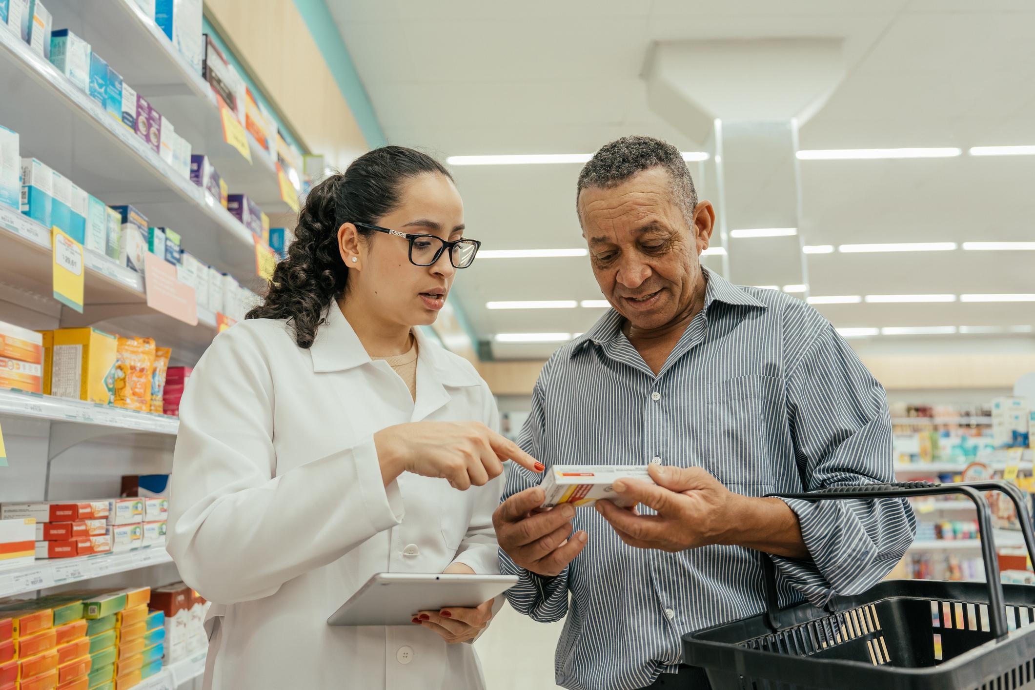 Pharmacist advising a patient on medication