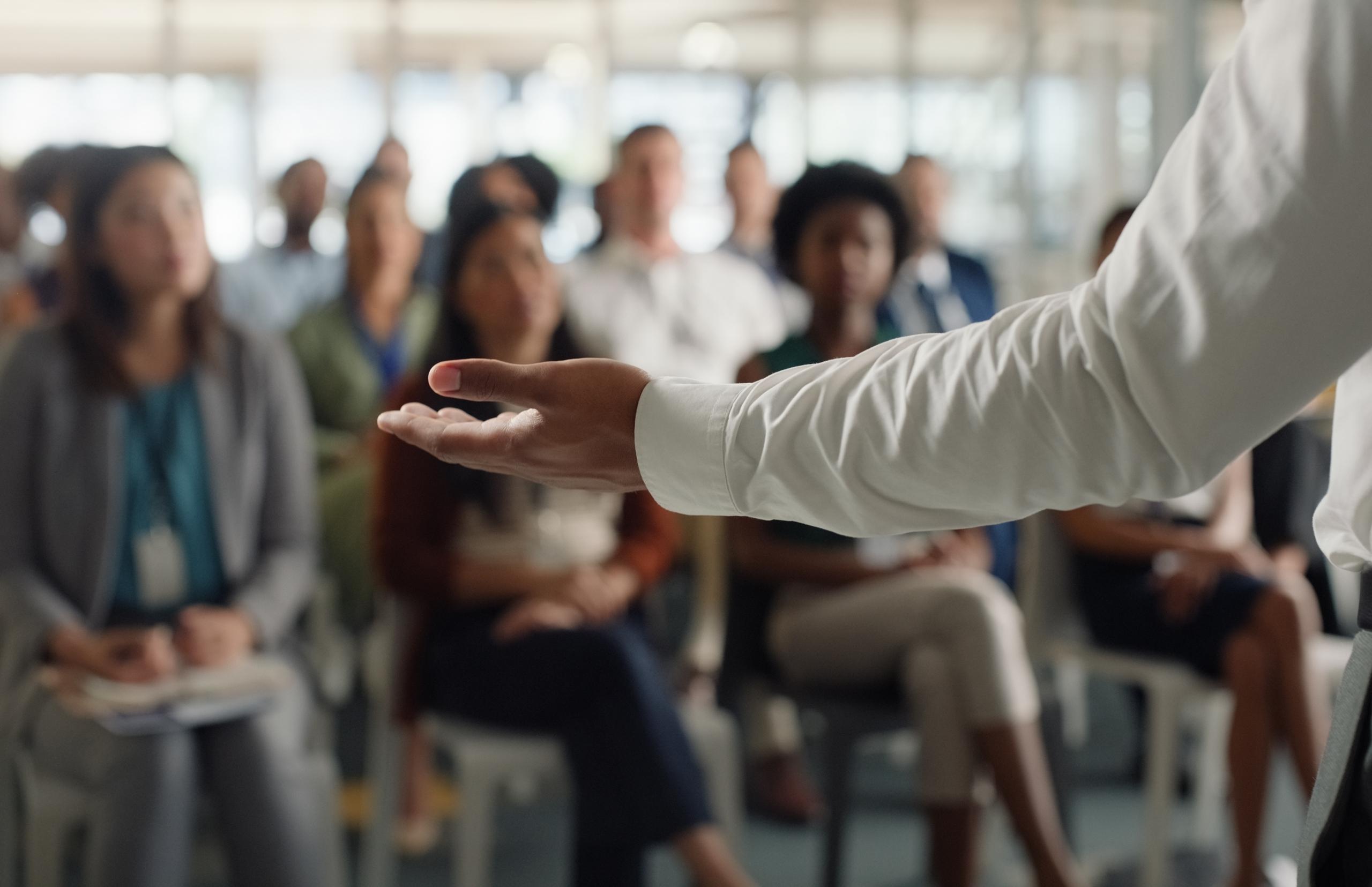 A speaker gives a talk to a crowd