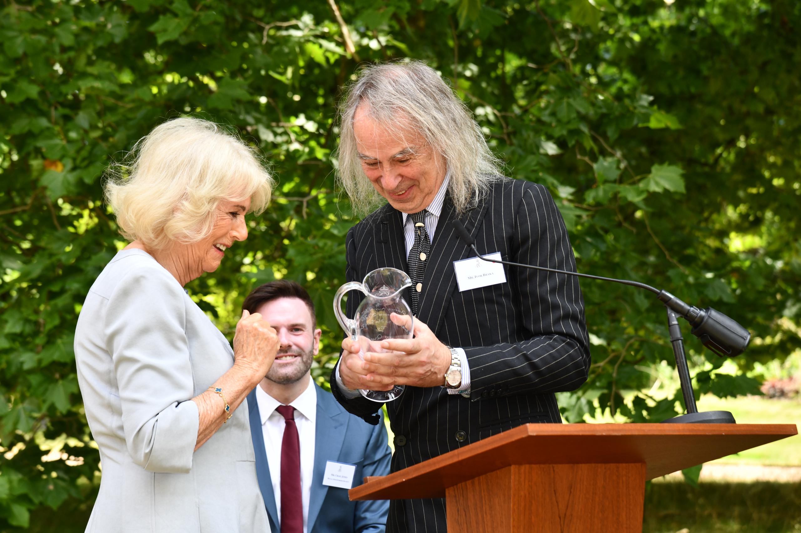 Her Majesty The Queen presenting award to Ivor Braka