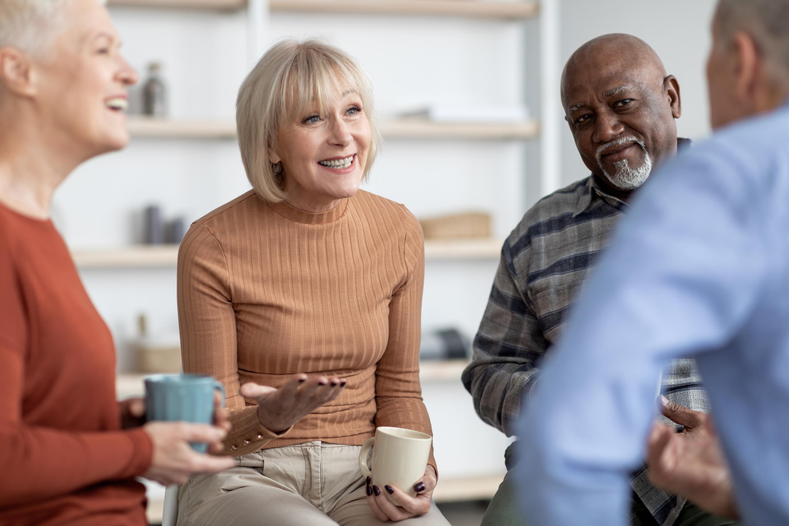 People chatting over tea and coffee