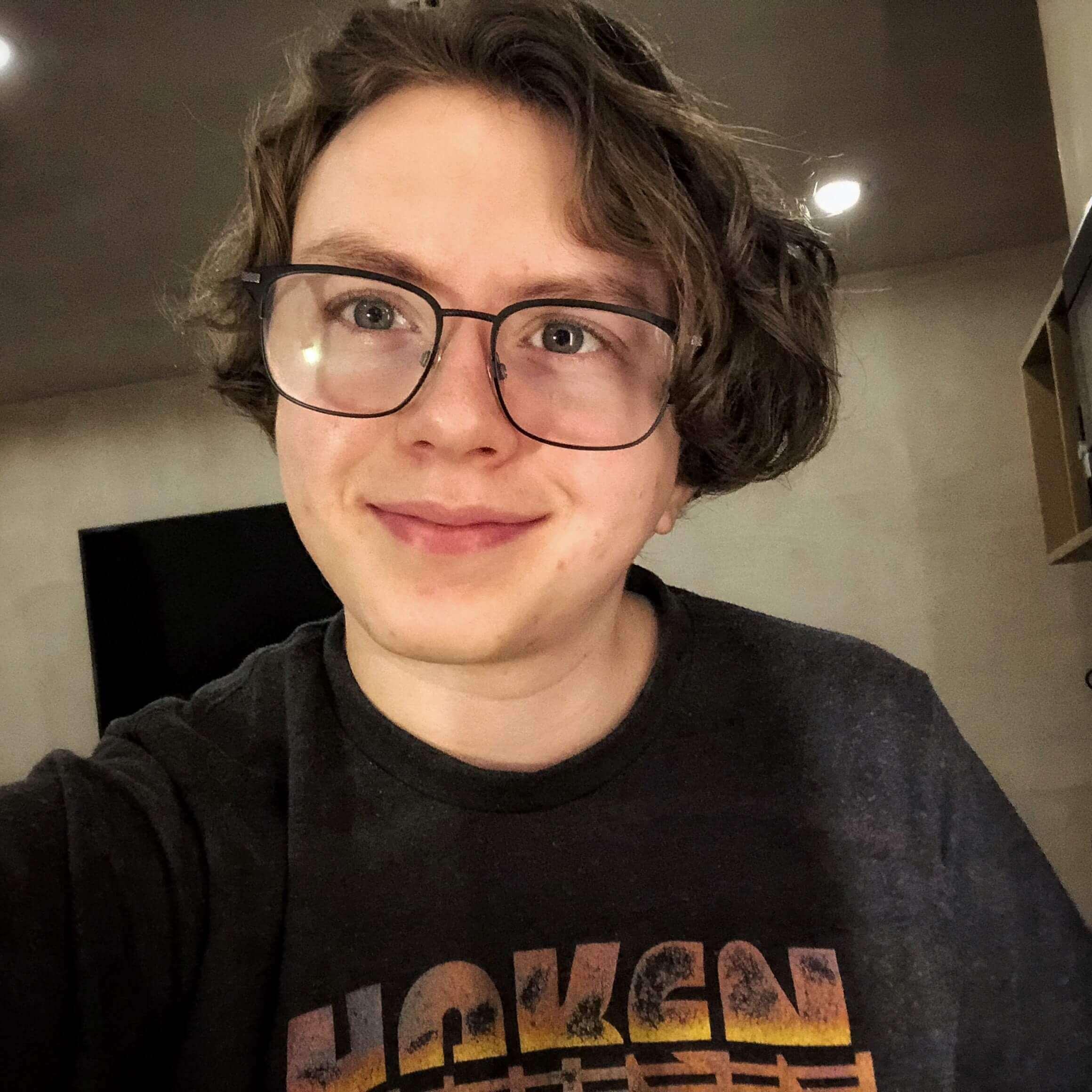 Picture of a person wearing a black t shirt
