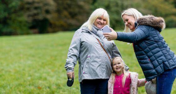 Mother, daughter and child taking a selfie