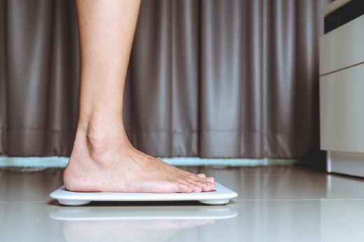 person stood on a vibration plate