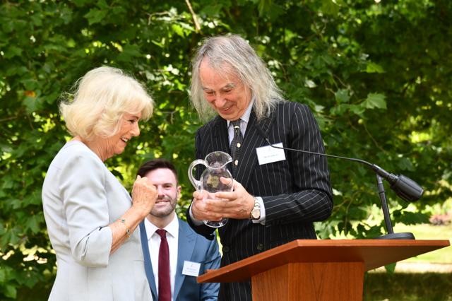 Her Majesty The Queen presenting award to Ivor Braka