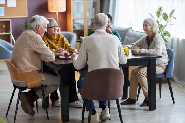Group of people chatting over lunch