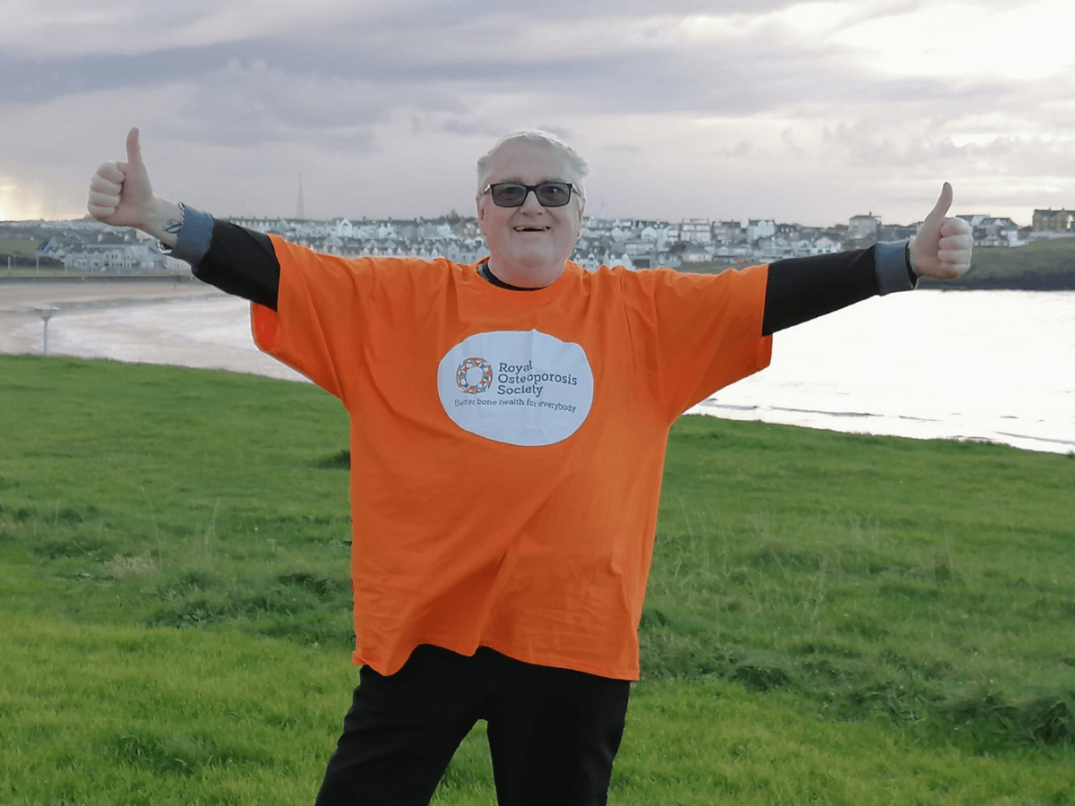 Fundraiser in an orange t shirt