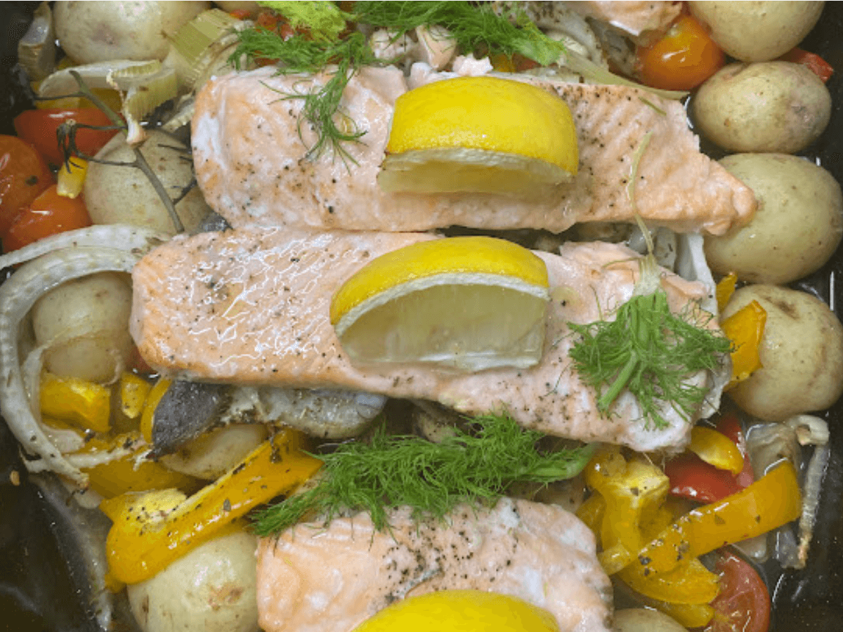 Baked salmon on a bed of vegetables