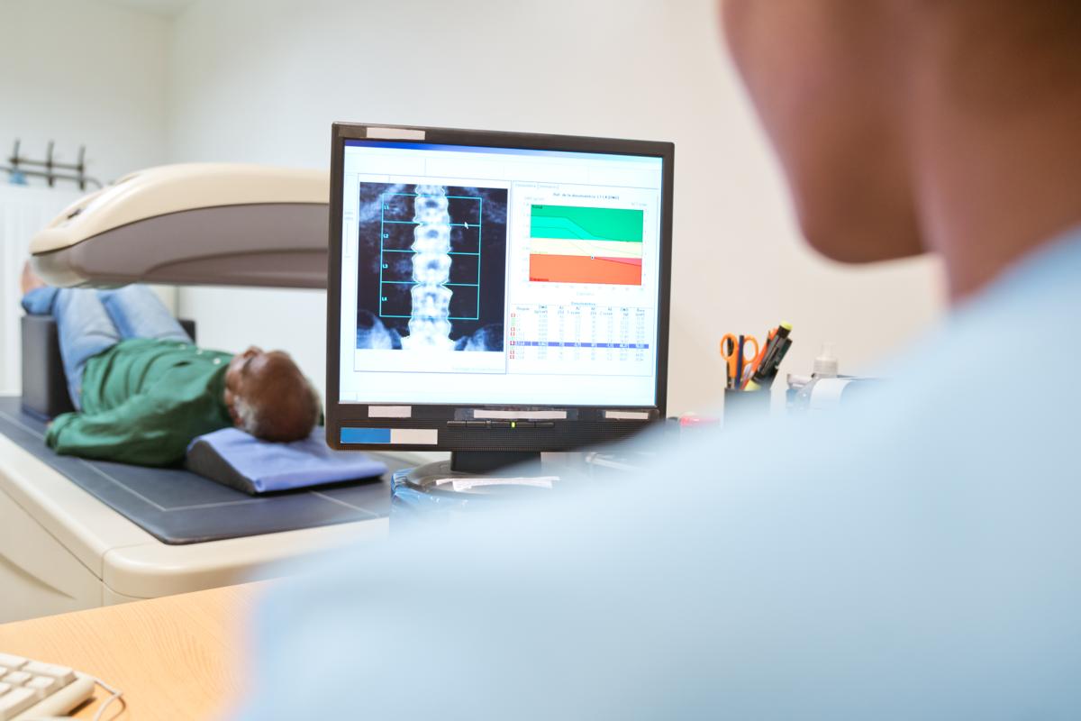 A computer showing a scan of a spine