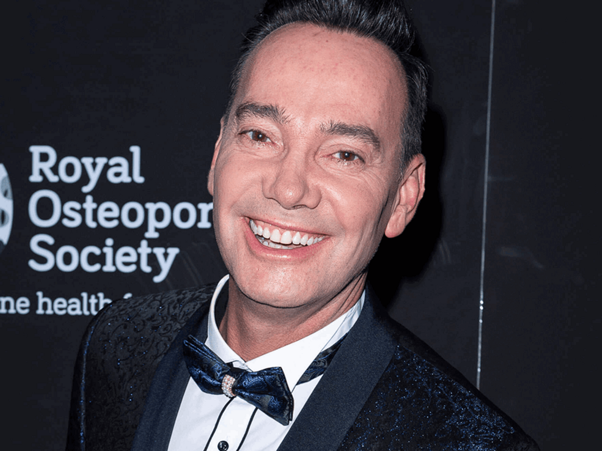 Portrait of Craig Revel Horwood, Royal Osteoporosis Society Ambassador, smiling in a suit with a bow tie