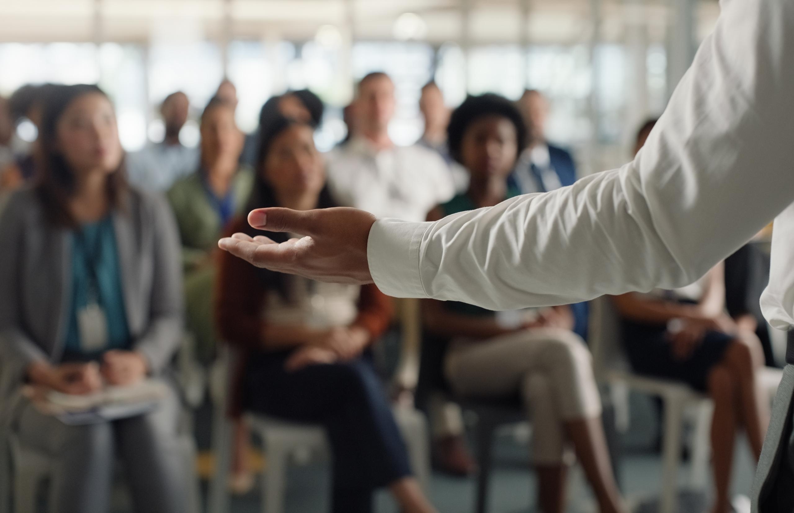 A speaker gives a talk to a crowd