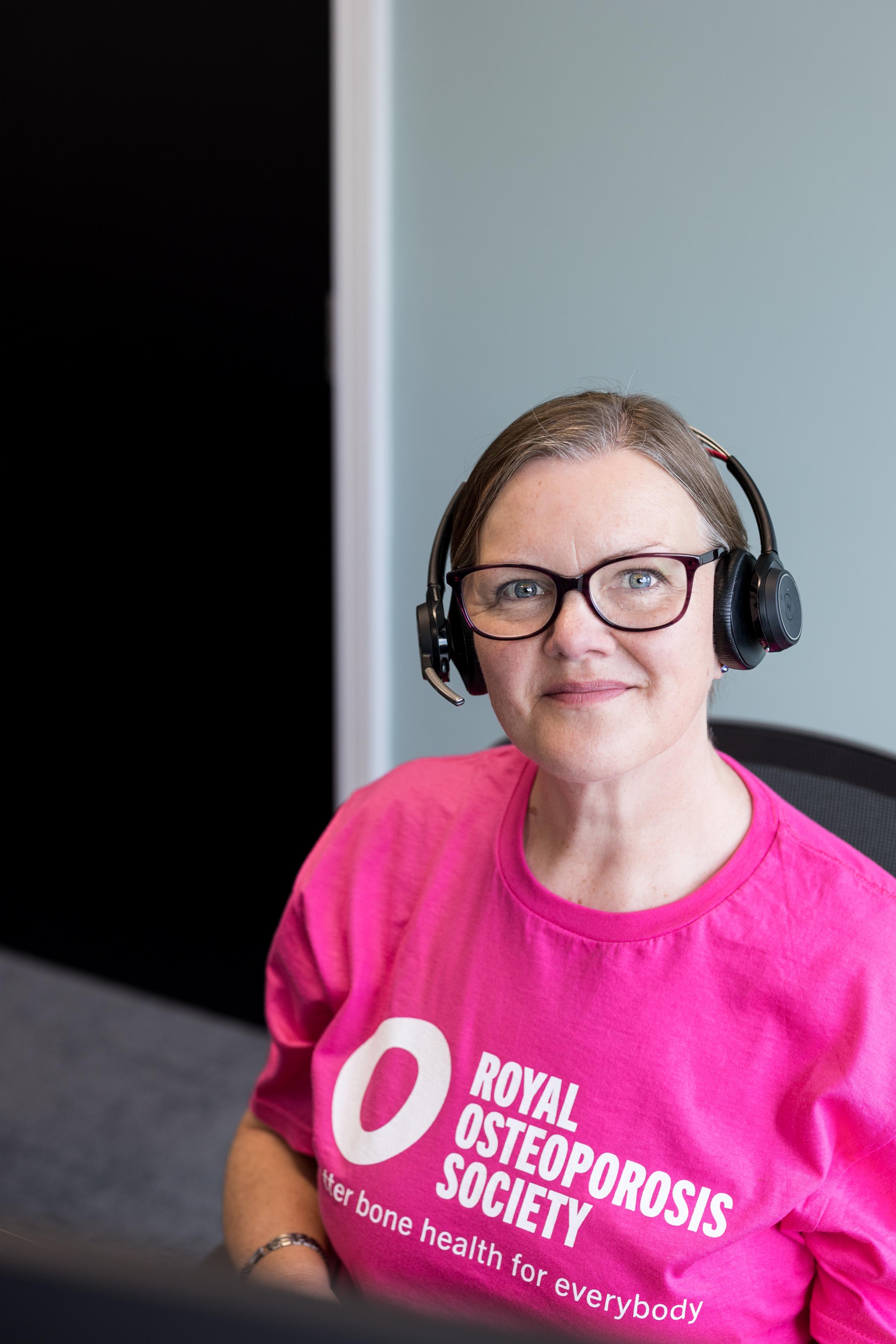 Nurse in ROS pink tshirt smiling at camera