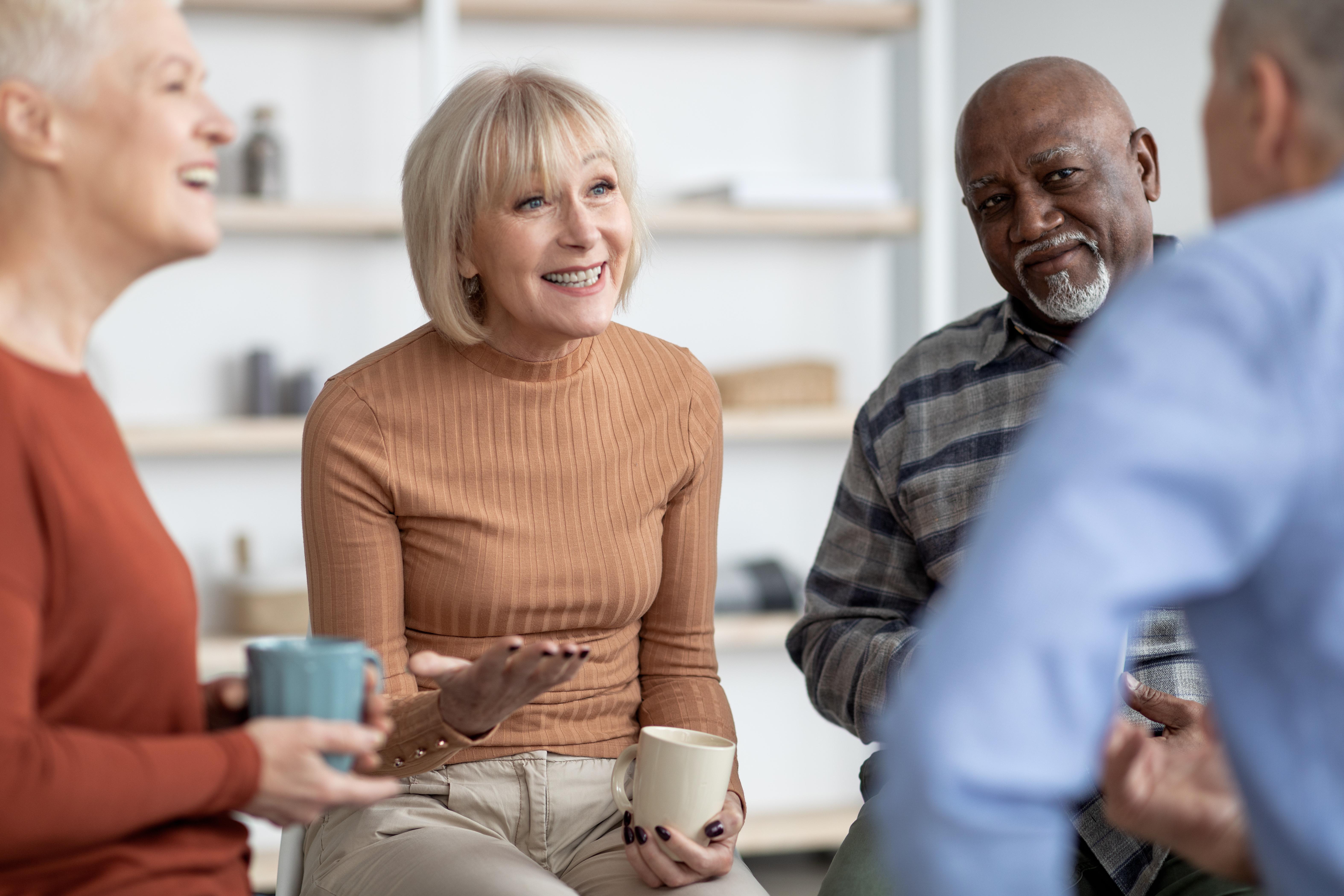 People chatting over tea and coffee