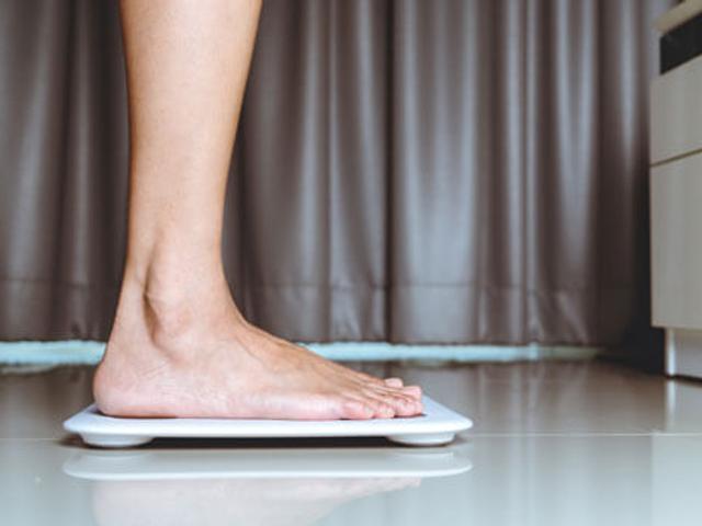 person stood on a vibration plate