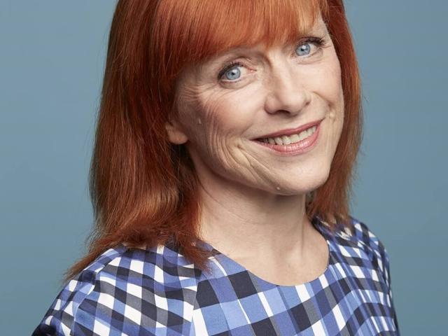 Sarah Jarvis, Royal Osteoporosis Society Ambassador, smiling, wearing a patterned top.