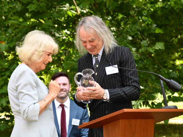Her Majesty The Queen presenting award to Ivor Braka